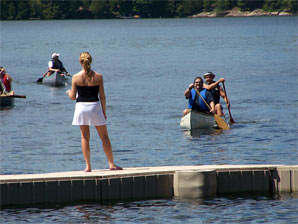 James and Neil in a canoe race, Kawagama Lake regatta