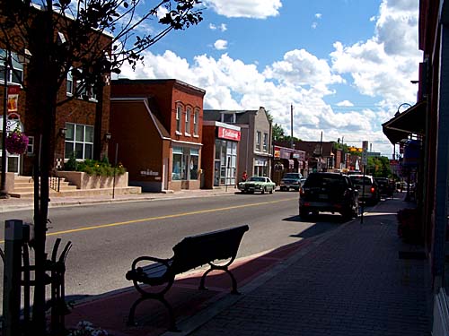 Downtown Acton, Mill St, with the park bench by the road