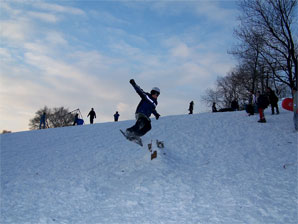 Snowboarders in Acton park