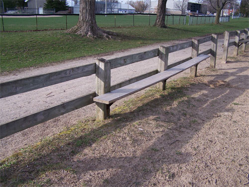 The bench and fence at one of Acton's Prospect Park beaches on Fairy Lake.