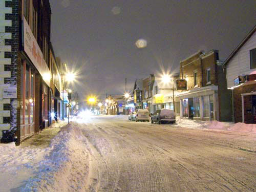 Snowfall in downtown Acton, Ontario. Night shot.