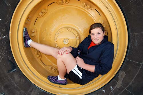 Acton Quarry open house -  Erin in an extremely large tire of a CAT dump truck