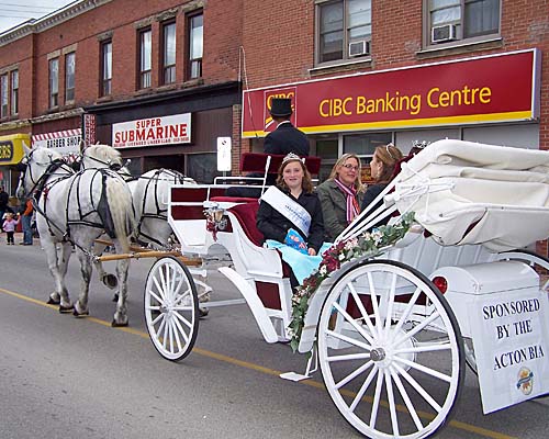 2007 Acton Ontario Fall Fair. The Miss Acton winners and Erin Hamilton, Leathertown Ambassador, drive in a horse drawn carriage during the fair parade