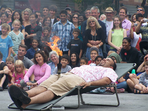 2006 Toronto Buskerfest - man from crowd becomes part of performance - fire juggling
