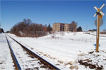 The sewage treatment plant's driveway heads to Churchill Rd South past the CN railway crossing