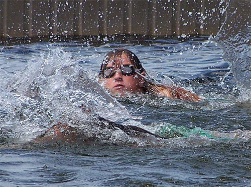Erin swims in a race at the Kawagama Lake regatta