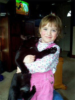 Erin carries Conan the cat