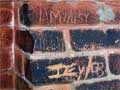 carvings into the bricks at Acton's old town hall