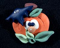 Hand made pins by artist Ann Hamilton - pumpkin with bat