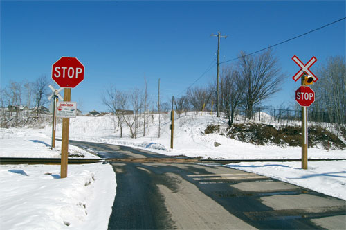 sewage treatment plant driveway at the CN rail line crossing