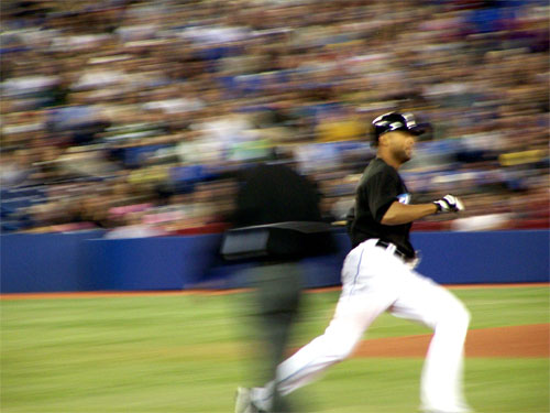 Blue Jays player passes first base, in a game against the Tigers