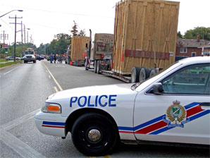 police block the road where overhead wires have been knocked down