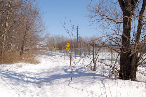 Acton nature pathway continues along sewage treatment property fence heading towards Churchill Road South