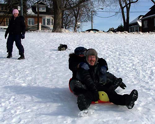 James and Ann toboggan down the hill at Riverdale Park in Toronto's Don Valley